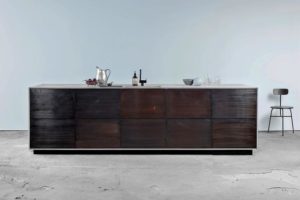 An Ikea Metod kitchen in bronzed tombac and sawn smoked oak veneer by the Danish company Reform